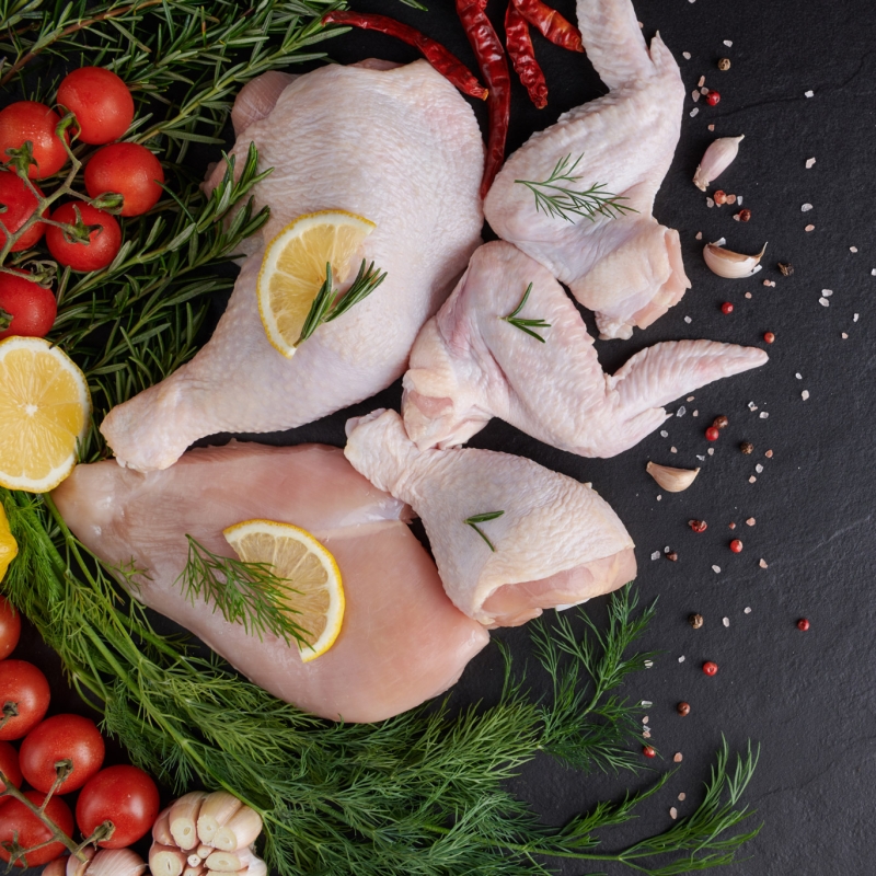 raw-chicken-fillet-with-garlic-pepper-rosemary-wooden-chopping-board-web